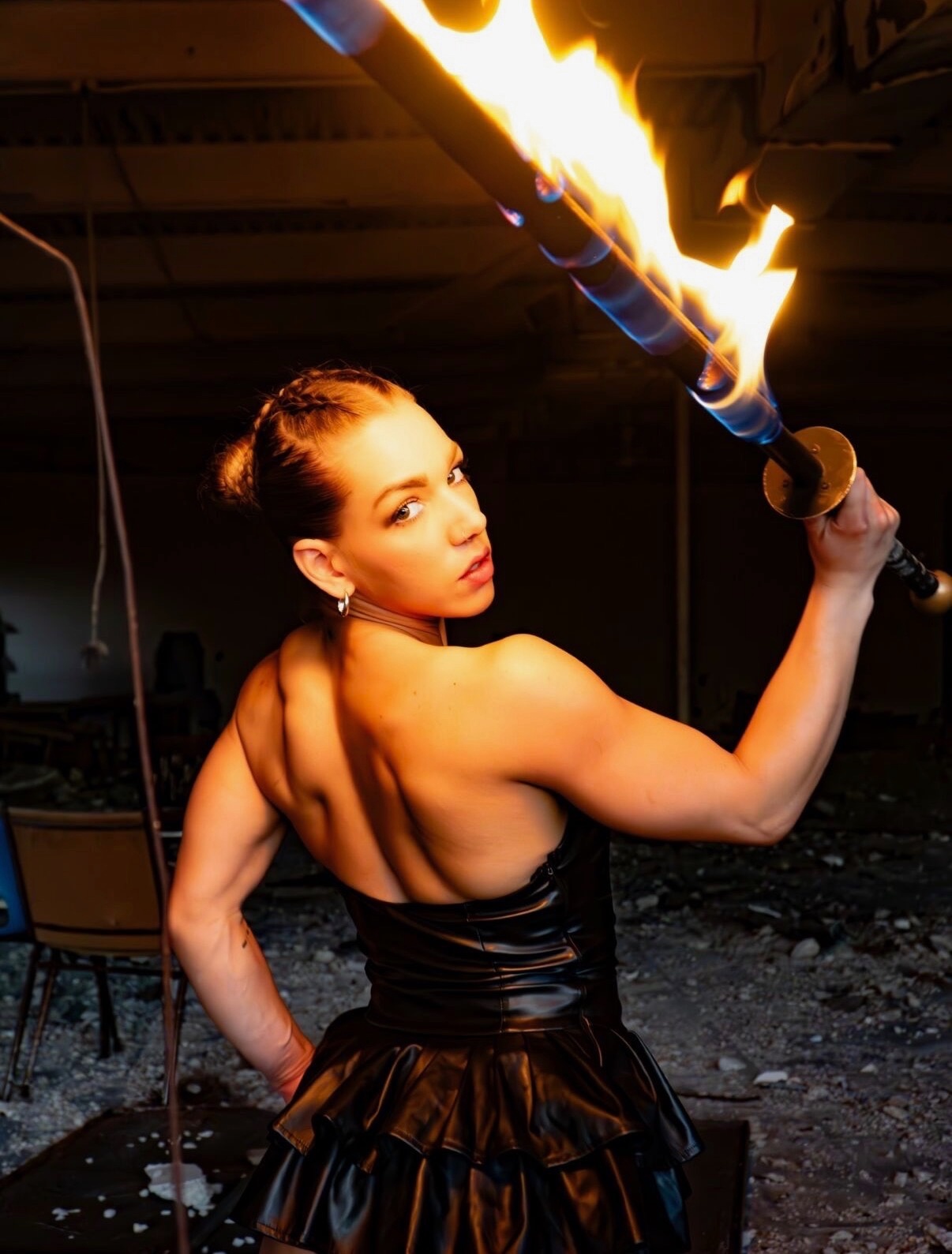 Daisy wielding fire staff in dramatic lighting