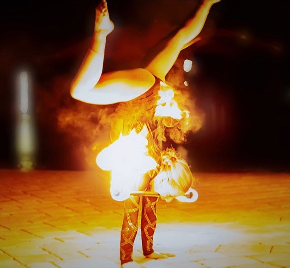 Inverted handstand with fire