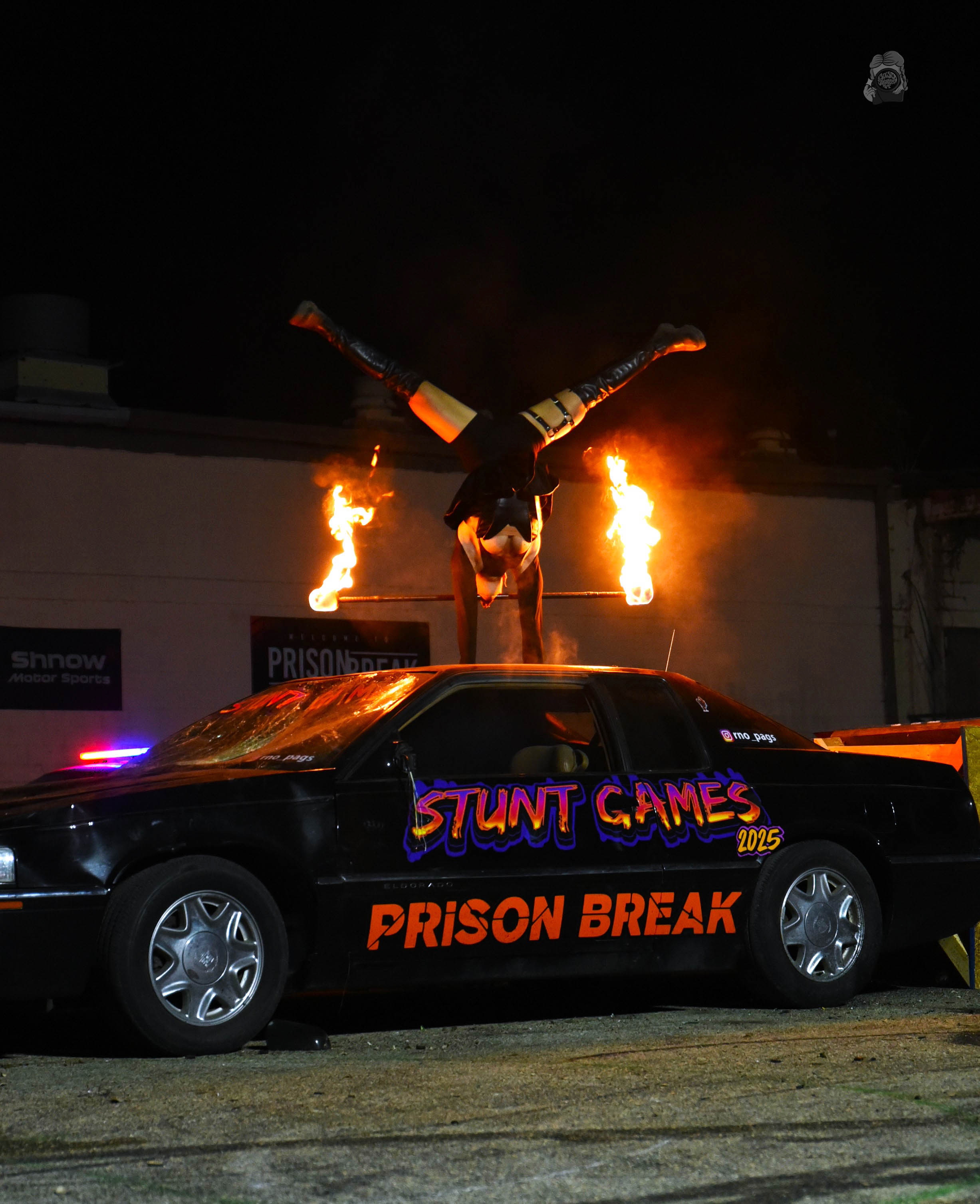 Fire stunt handstand on car